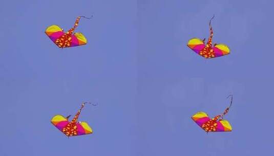 蓝天中飞舞的风筝高清在线视频素材下载