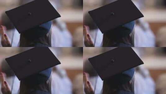 快乐的女人戴着毕业帽，为老师的告别鼓掌高清在线视频素材下载