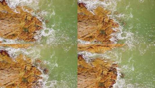 蓝色海浪拍打着海边礁石高清在线视频素材下载