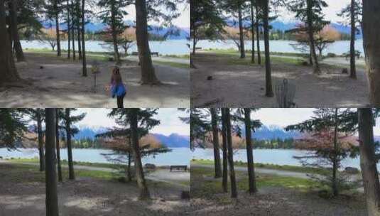 女孩在森林里玩飞盘镜头到南阿尔卑斯山高清在线视频素材下载