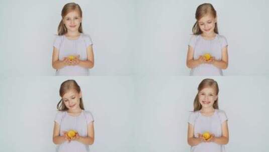女孩微笑着展示柠檬高清在线视频素材下载
