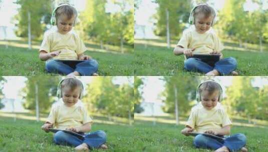 坐在草地上的小男孩高清在线视频素材下载