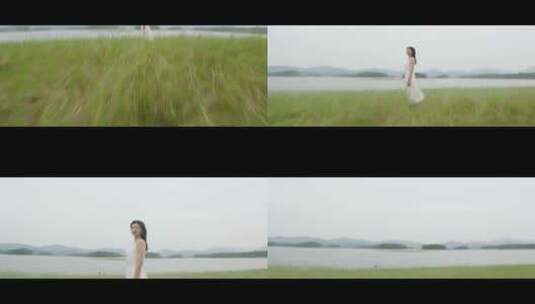 镜头扫过站在草地上的白色连衣裙女子高清在线视频素材下载