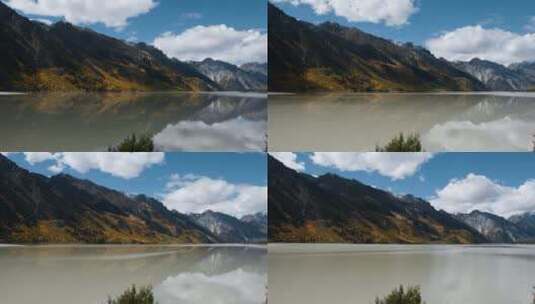 秋季高原湖泊金黄色森林雪山倒影高清在线视频素材下载
