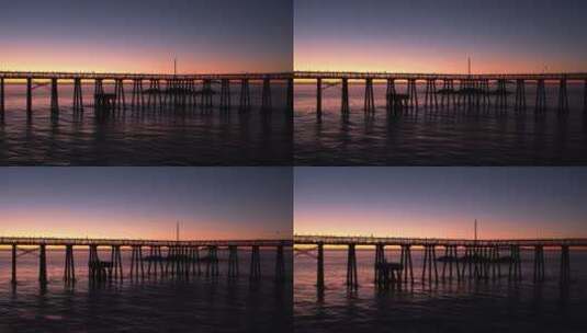 无人机 航拍 夕阳  黄昏  大海 海鸥  木桥高清在线视频素材下载