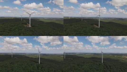 在阳光明媚的日子里飞越风力发电场高清在线视频素材下载