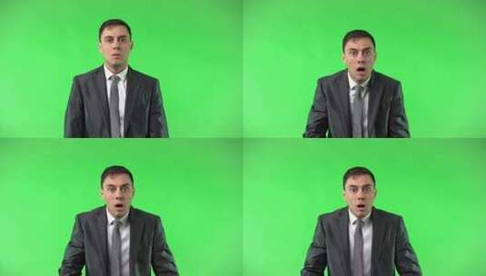 绿色背景前一名男性做张嘴吃惊的表情高清在线视频素材下载
