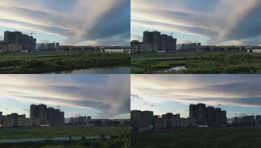 夕阳晚霞落日天空城镇建筑航拍镜头4K高清在线视频素材下载