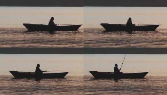 日落时坐在船上钓鱼的人高清在线视频素材下载