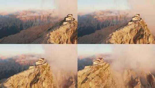 引人注目的悬崖小屋（Rifugio Nuvolau）坐落在Nuvolau山峰上，被日落照亮，意大利高清在线视频素材下载