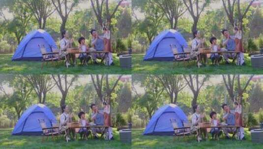 一家四口在露营地玩游戏开心欢呼庆祝高清在线视频素材下载