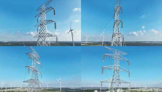 航拍风能风力发电场风车和高压电线塔高清在线视频素材下载