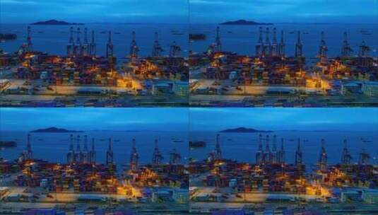 航拍傍晚蓝色大海和深圳蛇口港码头作业延时高清在线视频素材下载