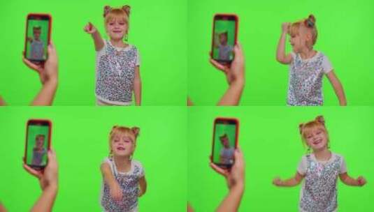 快乐的时髦博客儿童女孩在智能手机上为社交网络录制有趣的舞蹈视频高清在线视频素材下载