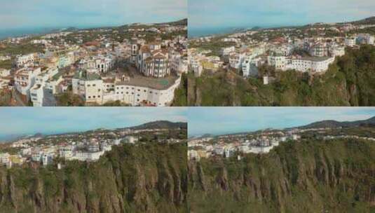 无人机从大加那利岛的一个有教堂的村庄飞走高清在线视频素材下载