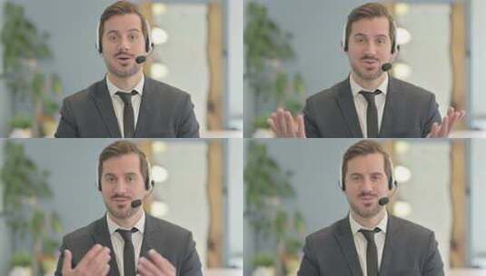 带耳机的商人与客户交谈高清在线视频素材下载