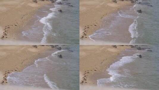 海滩海水冲刷沙滩和礁石60帧高清在线视频素材下载