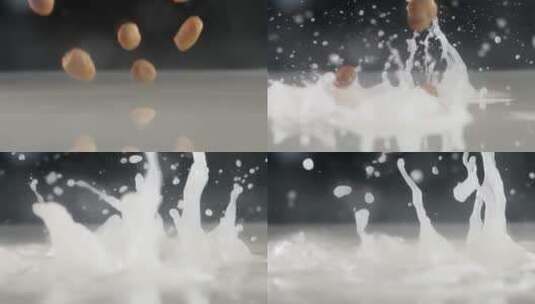 慢镜头拍摄有机花生米落入牛奶创意视频高清在线视频素材下载