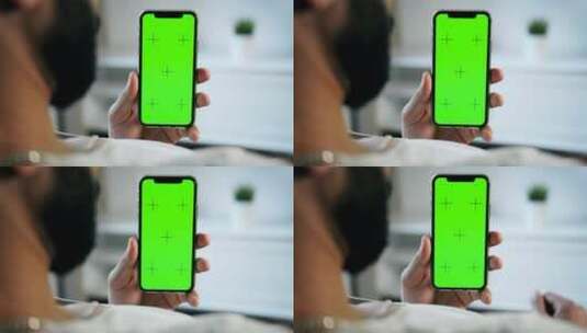 男子触摸手机绿屏高清在线视频素材下载