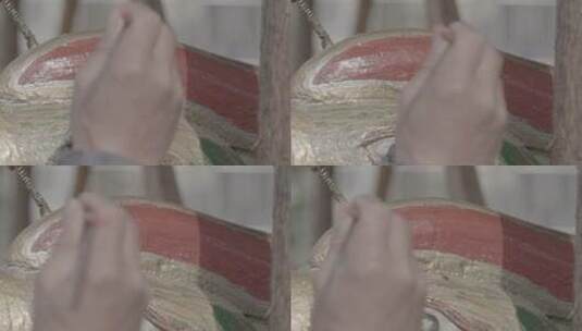 民间艺人在给一条凤舟刷彩漆LOG视频素材高清在线视频素材下载