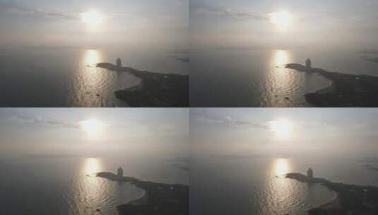 城市航拍青岛海边日落晚霞夕阳高清在线视频素材下载