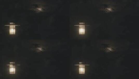 夜晚月亮在路灯后落下，月落高清在线视频素材下载