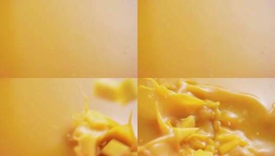 芒果粒落入芒果汁慢镜头高清在线视频素材下载