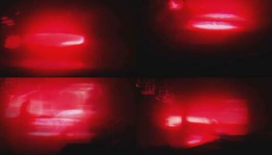 夜间模糊的红色汽车尾灯高清在线视频素材下载
