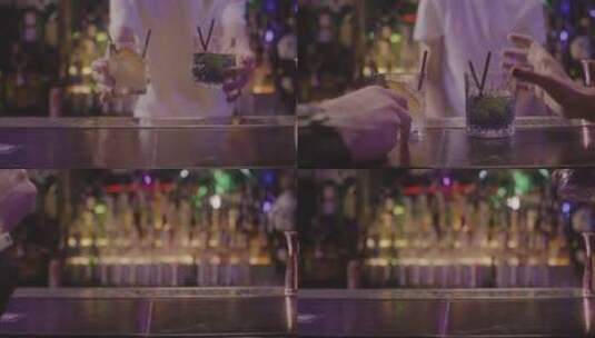 服务员把酒品放到酒吧柜台的特写镜头高清在线视频素材下载