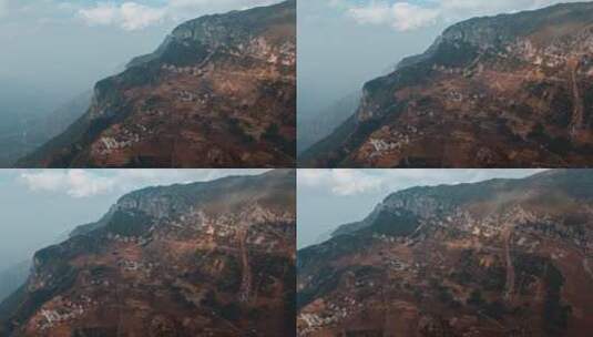 中国西南悬崖山坡上的村庄道路高清在线视频素材下载