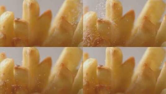 盐粒落在薯条上的特写高清在线视频素材下载