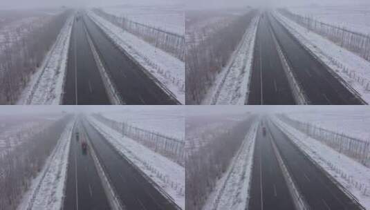 风雪中货运车队行驶在高速公路高清在线视频素材下载