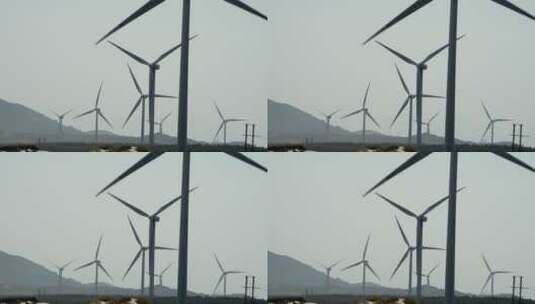 特写风力发电站  薄雾长焦实拍海岛风车高清在线视频素材下载