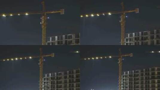 夜间建筑施工.延时摄影.带照明的建筑工地塔式起重机高清在线视频素材下载