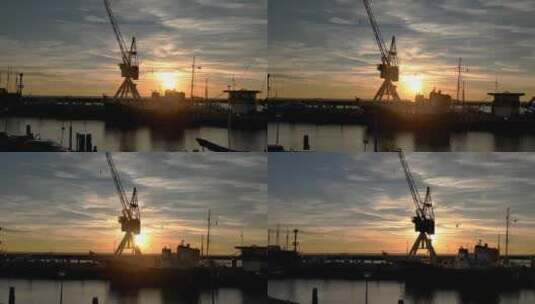 多莉拍摄了哈林根港的日落。荷兰拖船和老式起重机，背光高清在线视频素材下载