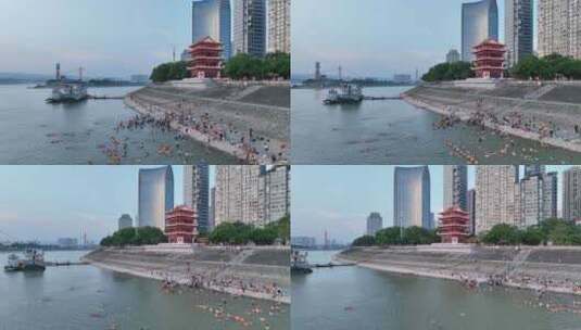 航拍宜昌镇江阁和长江里游泳的人群高清在线视频素材下载