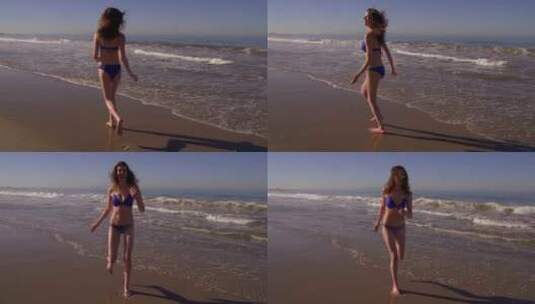 海滩上的顽皮女人高清在线视频素材下载