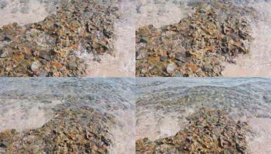 小海浪从小鹅卵石冲到岸上。海水或波浪运动带来的平静高清在线视频素材下载