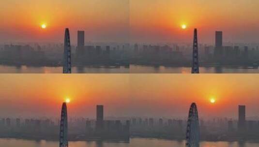 城市摩天轮清晨日出唯美航拍高清在线视频素材下载