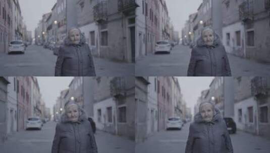 老妇人站在城市街道上高清在线视频素材下载
