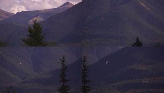 直升机在群山中低空飞行高清在线视频素材下载