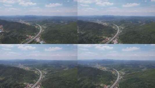 大山中的高速公路交通航拍高清在线视频素材下载
