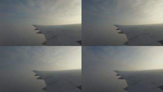 在蓝天中飞行的飞机机翼105高清在线视频素材下载