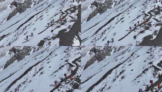 航拍攀登岷山山脉主峰雪宝顶雪山的登山队高清在线视频素材下载