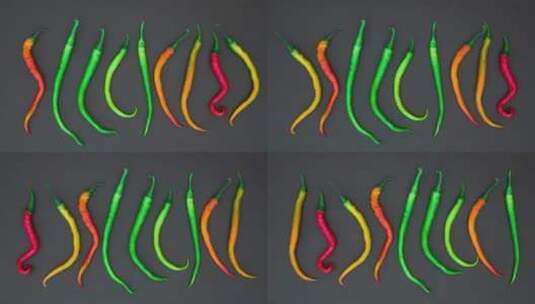 辣椒在黑色表面上排成一行定格动画视频高清在线视频素材下载