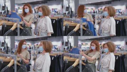 两个女孩在商场买衣服高清在线视频素材下载