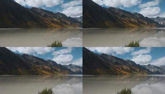 秋季高原湖泊金黄色森林雪山倒影延时视频高清在线视频素材下载