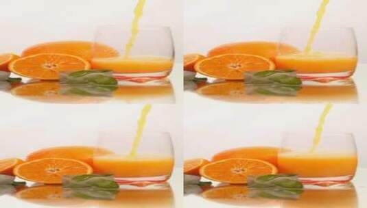 玻璃杯里盛果汁_在白色的背景上放一些橙子高清在线视频素材下载