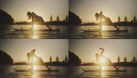 黄昏时分女孩在湖上做瑜伽高清在线视频素材下载