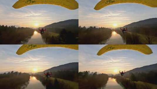 FPV无人机航拍动力滑翔伞飞行日落森林河流高清在线视频素材下载